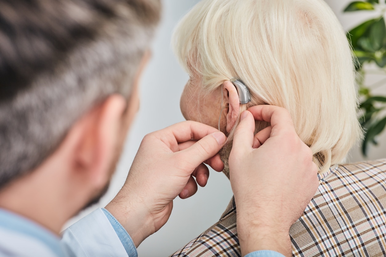 Woman being fit with a hearing aid