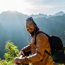 Happy man smiling on his hike