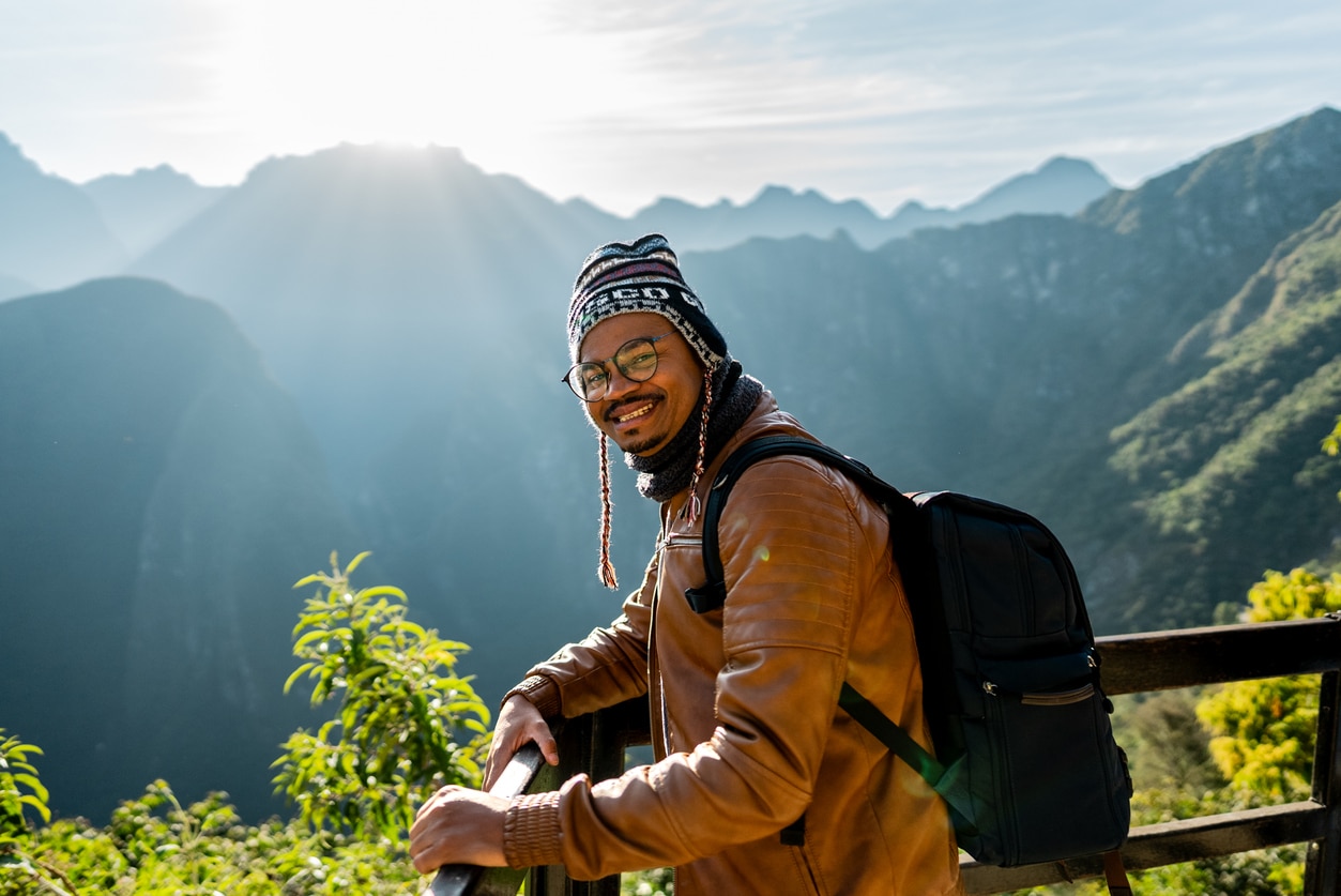 Happy man smiling on his hike.