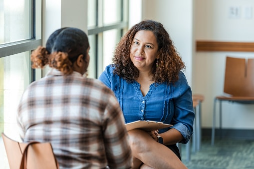 Young woman talking to her therapist.